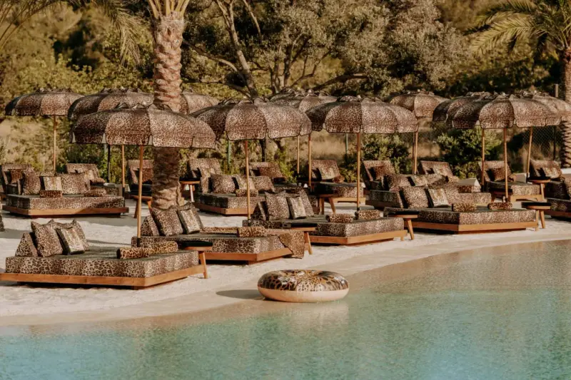 Luxury pool with loungers at CLAP House Ibiza for a private day with a high-class escort