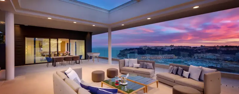 Luxury hotel suite in Monaco with private terrace and sunset sea view