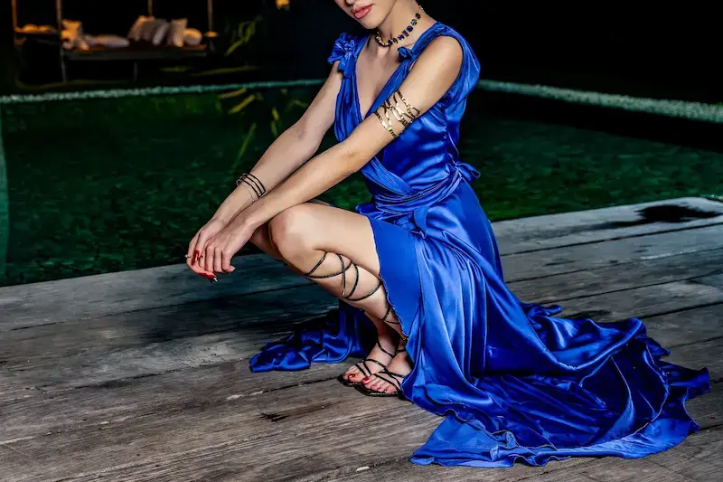 VIP escort in Dublin from a high-class escort service, in an elegant blue gown, Top Companions